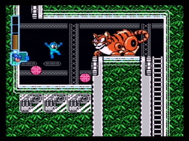 Mega Man: Anniversary Collection (PlayStation 2) screenshot: This giant cat blocks your path - defeat him and dodge its hairballs!