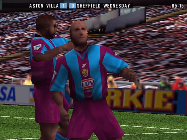 The F.A. Premier League Stars (Windows) screenshot: Players celebrating. All kits are unique in this one.