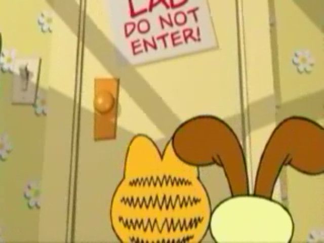 Garfield's Mad About Cats (Windows) screenshot: Garfield and Odie descend into the lab to build the perfect cat.