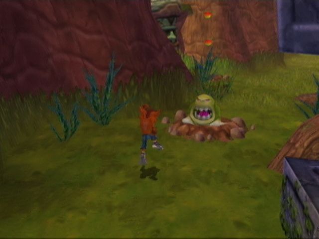 Crash Twinsanity (Xbox) screenshot: Belly flop on these worms and they'll burrow to the next hole.