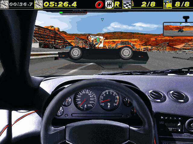 The Need for Speed (DOS) screenshot: An overturned Vette at Rusty Springs