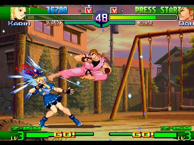 Street Fighter Alpha 3 (PlayStation) screenshot: Karin getting kicked by Dan.