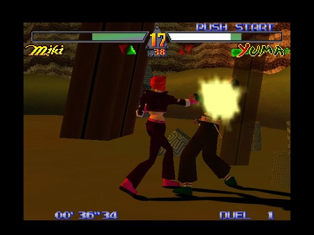 Deadly Arts (Nintendo 64) screenshot: Miki delivering a series of punches to Yuma.