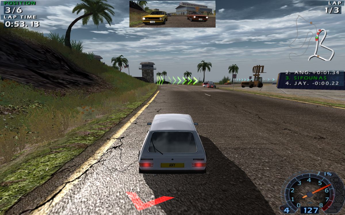 World Racing 2 (Windows) screenshot: The red arrow behind the player's car indicates that an opponent is very close