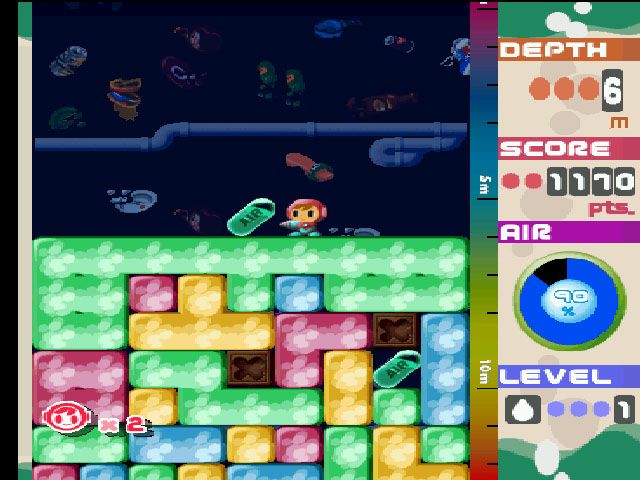 Mr. Driller (PlayStation) screenshot: You need to pick up air capsules along the way to keep Mr. Driller's health up. The deeper you go, the faster it drops.
