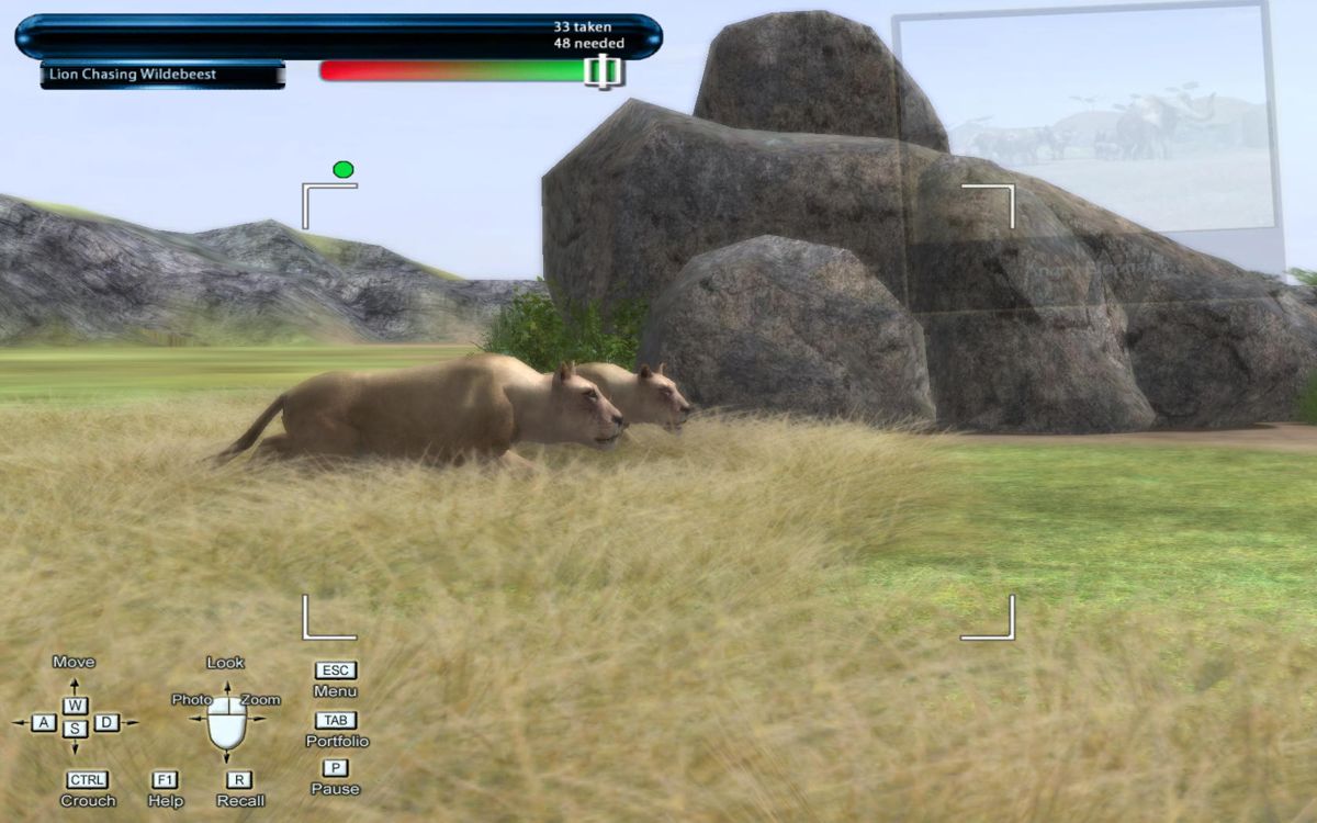 Safari Photo Africa: Wild Earth (Windows) screenshot: Two lionesses stalking an easy prey. Look how well-concealed they are by tall grass.