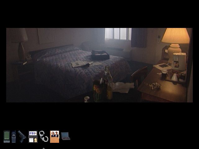 The X-Files Game (Windows) screenshot: Inside agent Mulder's hotel room