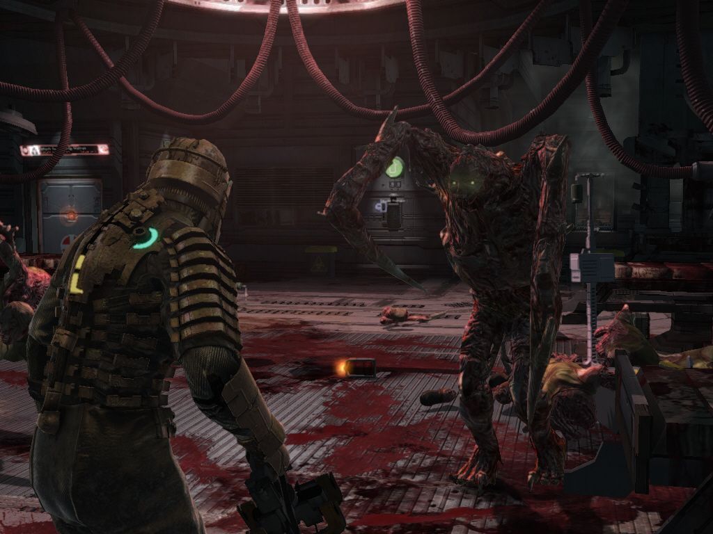 Dead Space (Windows) screenshot: This necromorph keeps regenerating, even if I dismember him. How am I supposed to kill it, I wonder?