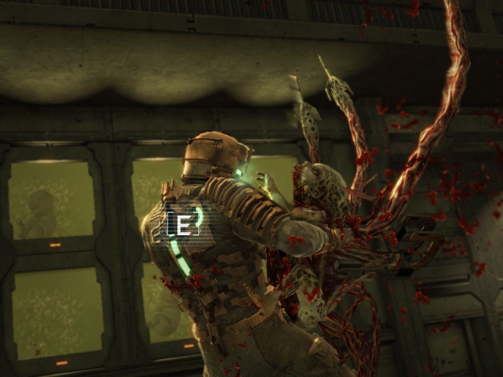 Dead Space (Windows) screenshot: A very close encounter with a mutated baby ... I have to shake it off!
