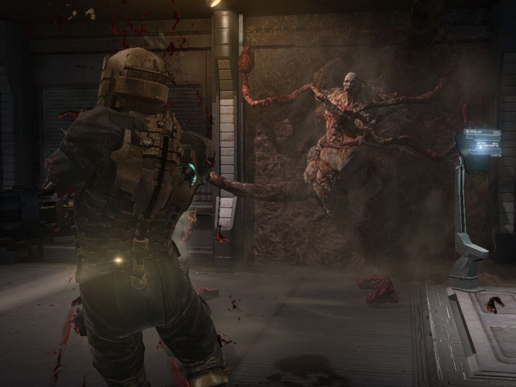 Dead Space (Windows) screenshot: Another disgusting enemy... the best way to kill it is ,as usual in this game, by dismemberment. I have to cut off all of his tentacles.