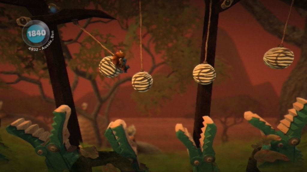 LittleBigPlanet (PlayStation 3) screenshot: Don't fall into the snapping crocs!