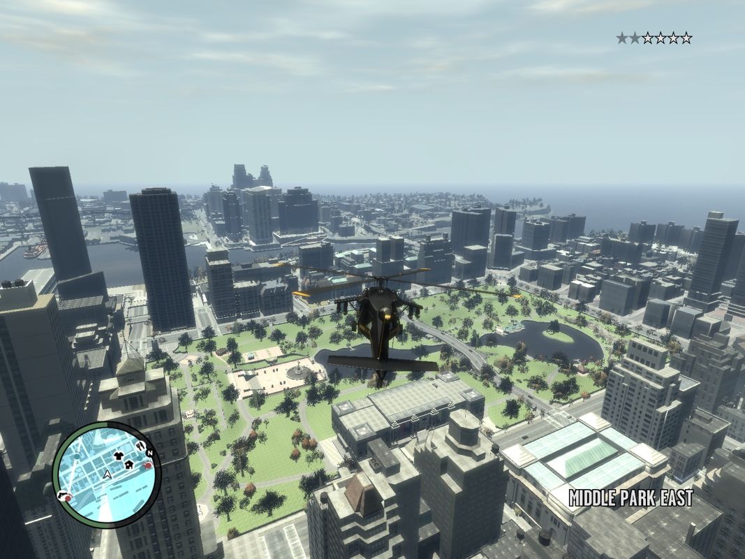 Grand Theft Auto IV (Windows) screenshot: Ah that's life. Being hunted by the police and flying a heavily armed helicopter over the city.