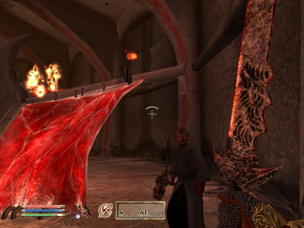The Elder Scrolls IV: Oblivion (Windows) screenshot: About to close an Oblivion gate - the Dremora magicians have summoned two Fire Atronachs
