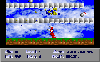 Devil Land (DOS) screenshot: If you bounce on a block from below, a shower of coloured balls appears.
