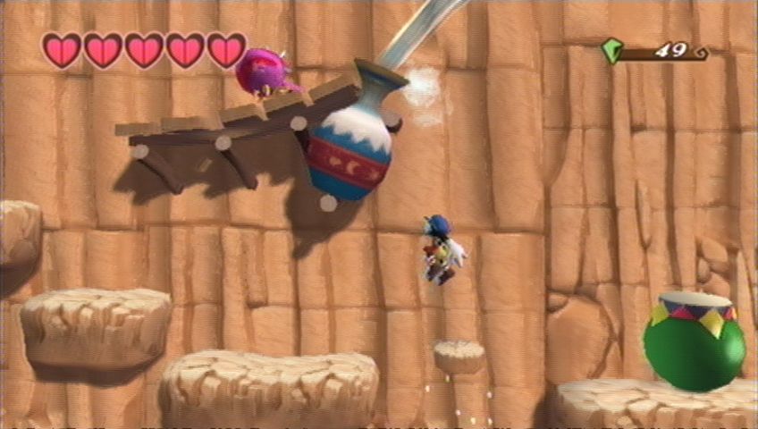 Klonoa (Wii) screenshot: The water pouring out of the jug acts as a waterslide