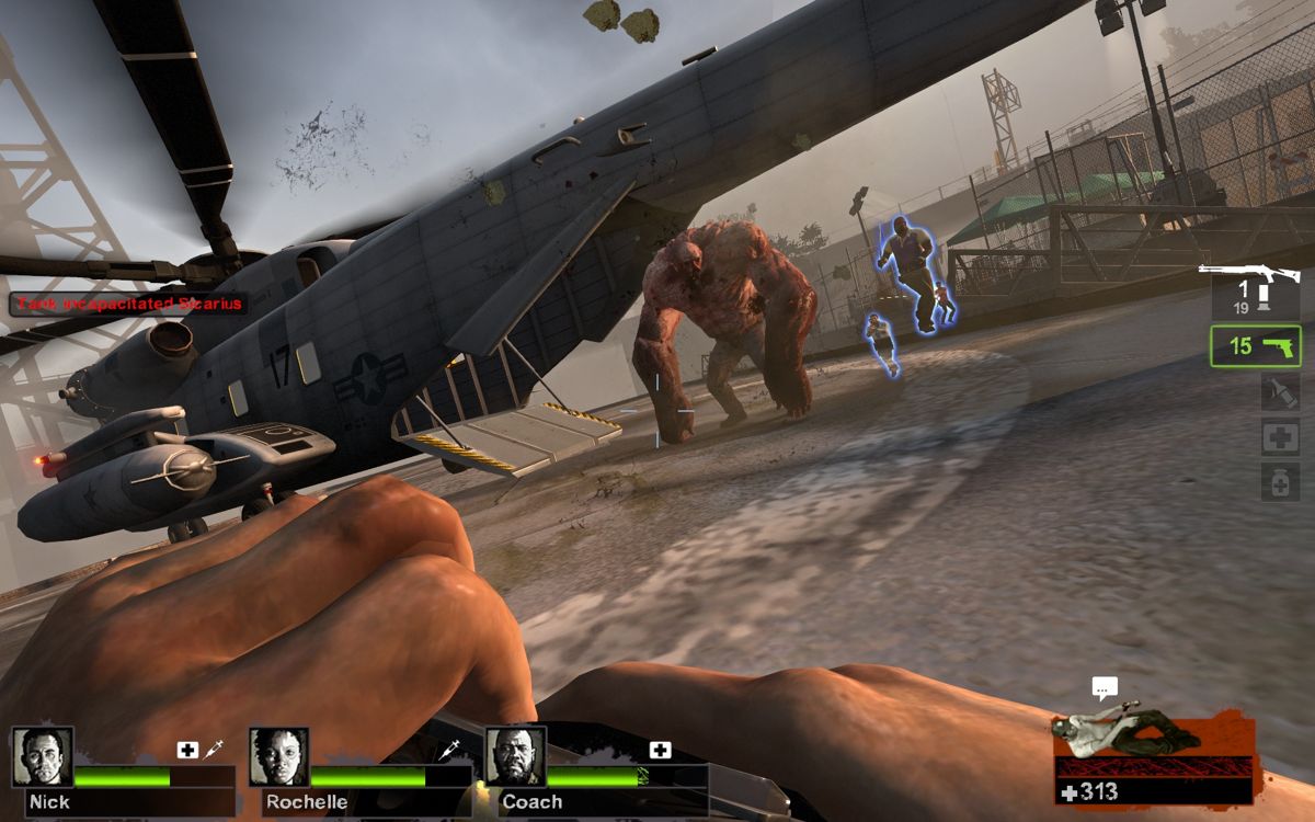 Left 4 Dead 2 (Windows) screenshot: We just need to get into that helicopter but I guess that tank doesn't want me to.