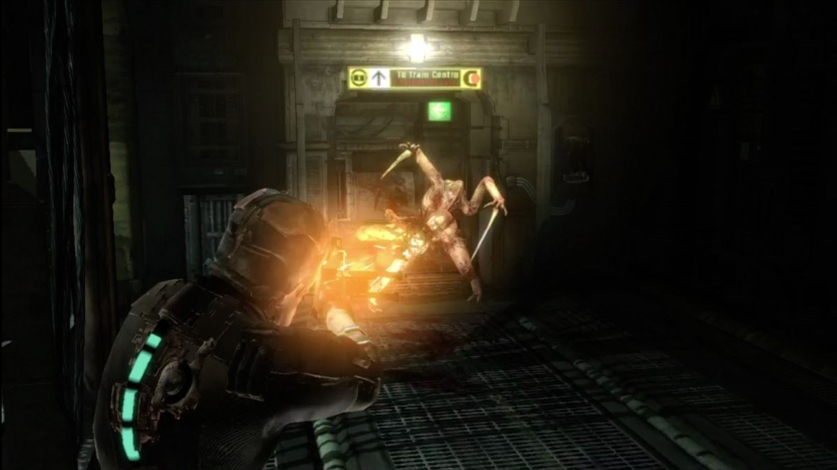 Dead Space (Xbox 360) screenshot: Mining tools are dangerous! Cut off their limbs for extra damage.