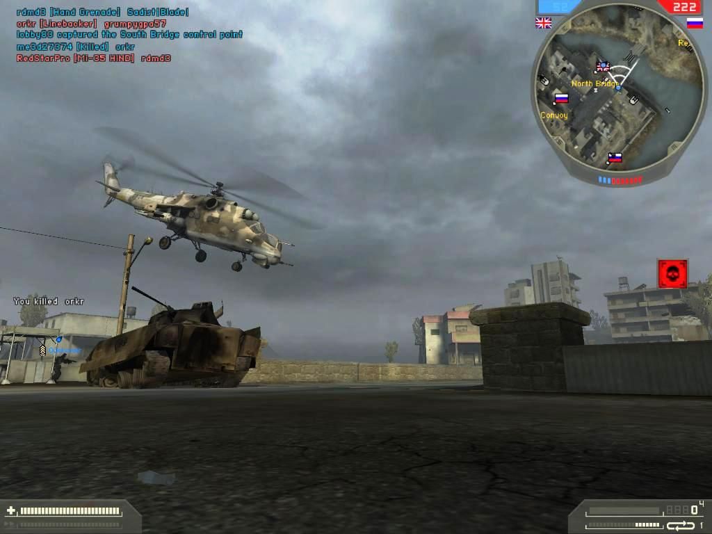 Battlefield 2: Special Forces (Windows) screenshot: Ghost Town-Russian HIND comes to the aid of the destroyed Anti-Air