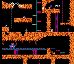 Spelunker (NES) screenshot: On a mine cart; watch out for the danger overhead and proceed with caution