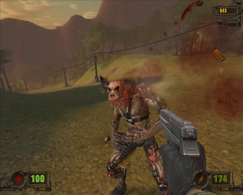 Vivisector: Beast Within (Windows) screenshot: Vivisection in full effect. At least my headshot left this poor creature with one ear on his skull.
