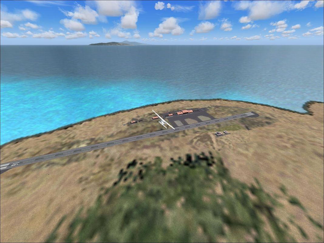 Scenery Spain 3: Canary Islands (Windows) screenshot: El Hierro viewed from a distance and at altitude to show the size of the airport Flight Simulator 2004