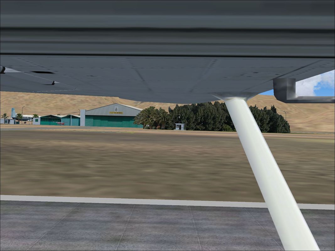 Scenery Spain 3: Canary Islands (Windows) screenshot: El Berriel is a small private airfield. This is the view from the window during take-off Flight Simulator 2004