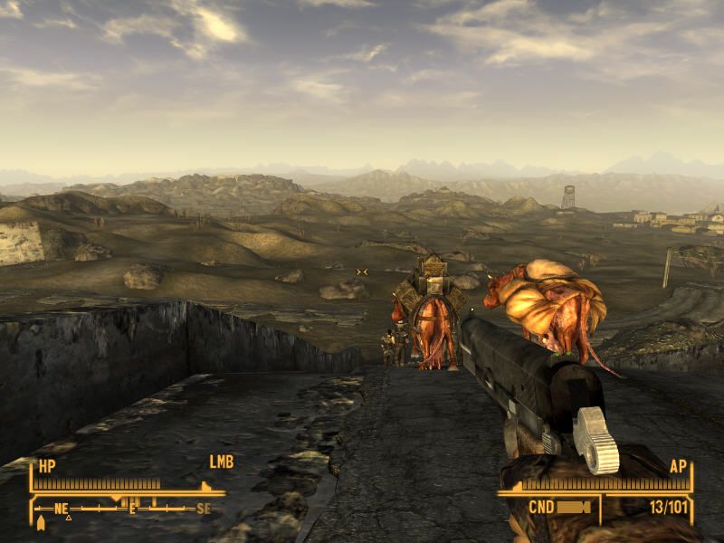 Fallout: New Vegas (Windows) screenshot: I followed a trader caravan with a couple of brahmins, only to reach these highway ruins with an awesome view!