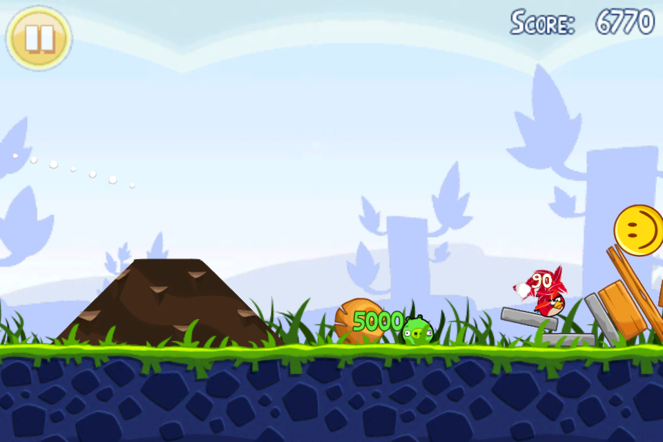 Angry Birds (iPhone) screenshot: Later on, objects such as stones are introduced which can roll and crush pigs.