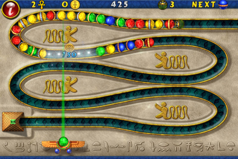 Luxor (iPhone) screenshot: By hitting balls of the same colour, the balls stop briefly