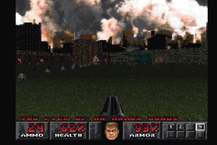 Doom (PlayStation) screenshot: Fighting in Doom II's Courtyard level.
