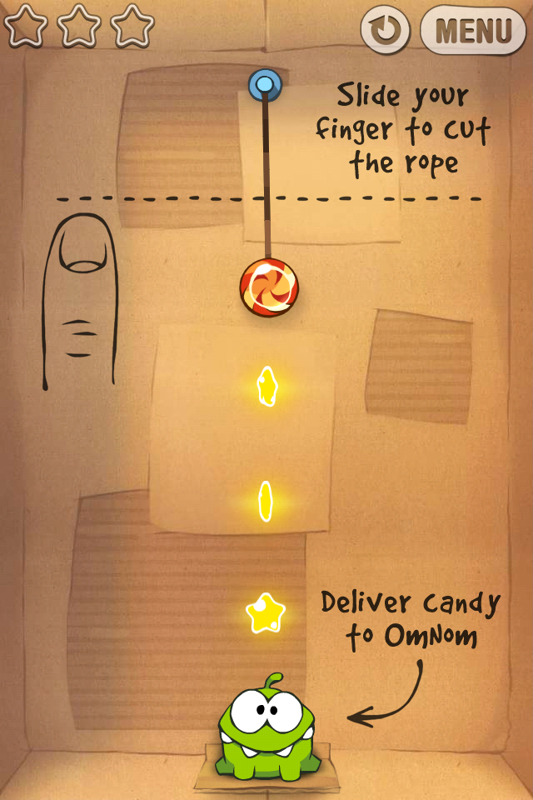 Cut the Rope (iPhone) screenshot: Level 1-1, the first few levels act as a tutorial