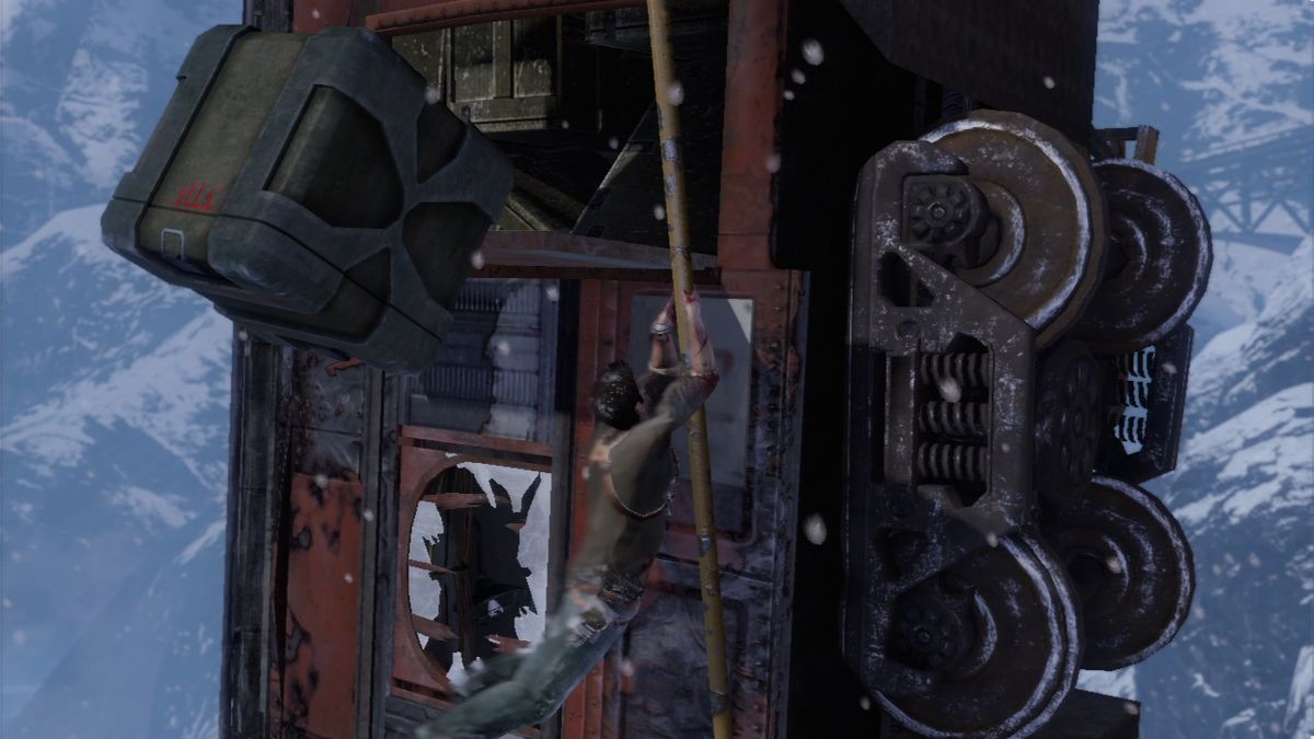 Uncharted 2: Among Thieves (PlayStation 3) screenshot: Game starts quite intense as you climb up the train hanging from the cliff.