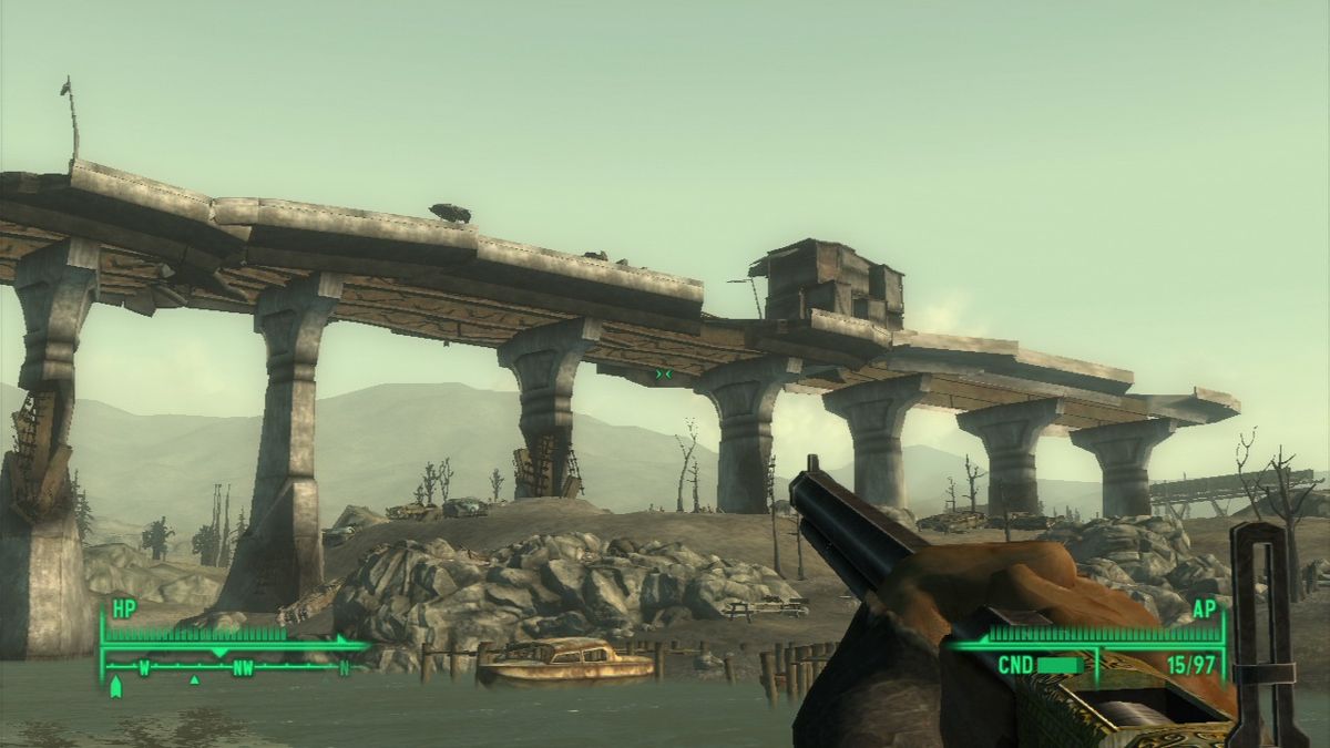 Fallout 3 (PlayStation 3) screenshot: A small little town on what's left of the highway... house objects will become visible as you draw closer.