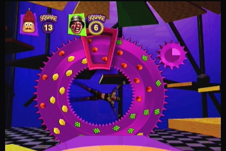 Twisted: The Game Show (3DO) screenshot: As you move on the gameboard, you may land on the spinning wheel of Torture. Match three to escape.