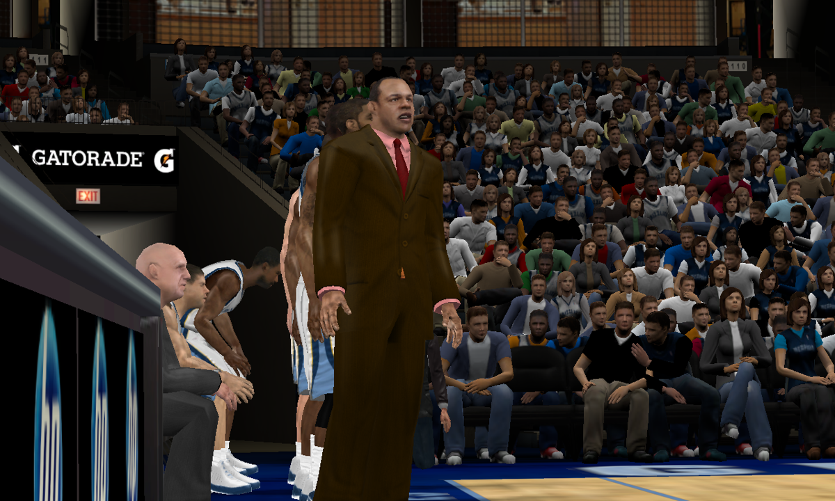 NBA 2K11 (Windows) screenshot: Grizzlies coach Lionel Hollins and the team's bench players look on as the game is about to begin.