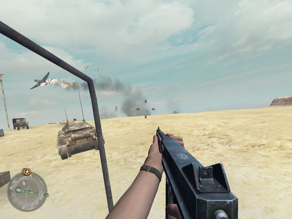 Call of Duty 2 (Macintosh) screenshot: Plane going down over head as we advance to our target