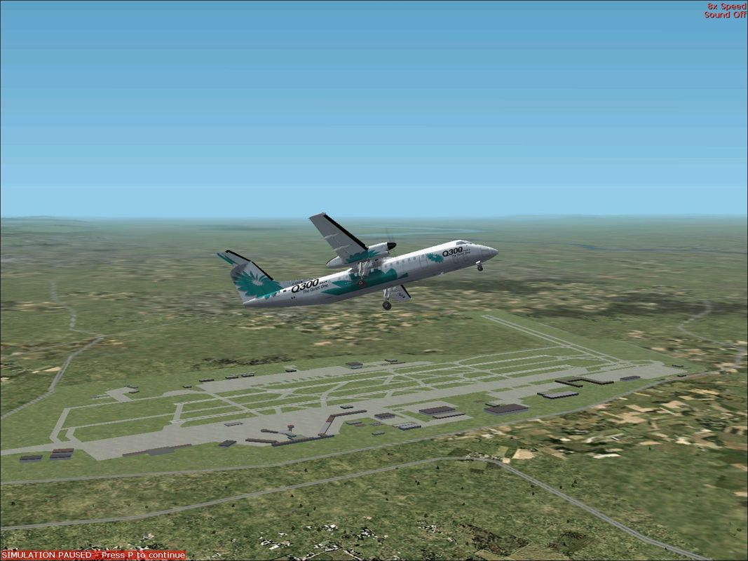 Dash 8-300 Professional (Windows) screenshot: This is the Dash 8-Q300 flying over the flight simulator's enhanced Amsterdam Schiphol airport that comes with this product. This is the Dash 8 300 'Q' Rollout livery