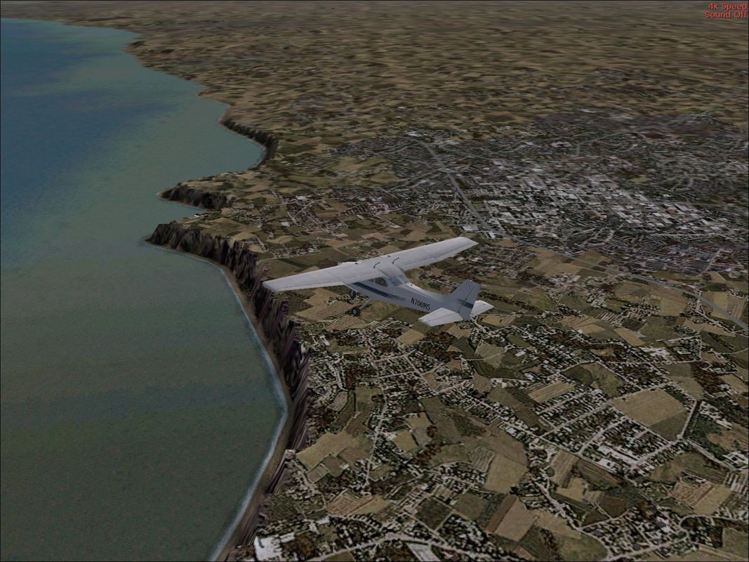 VFR Photographic Scenery: Northern England (Windows) screenshot: The North East coastline. I know this coast and there are cliffs but I'm sure they are just not this dramatic