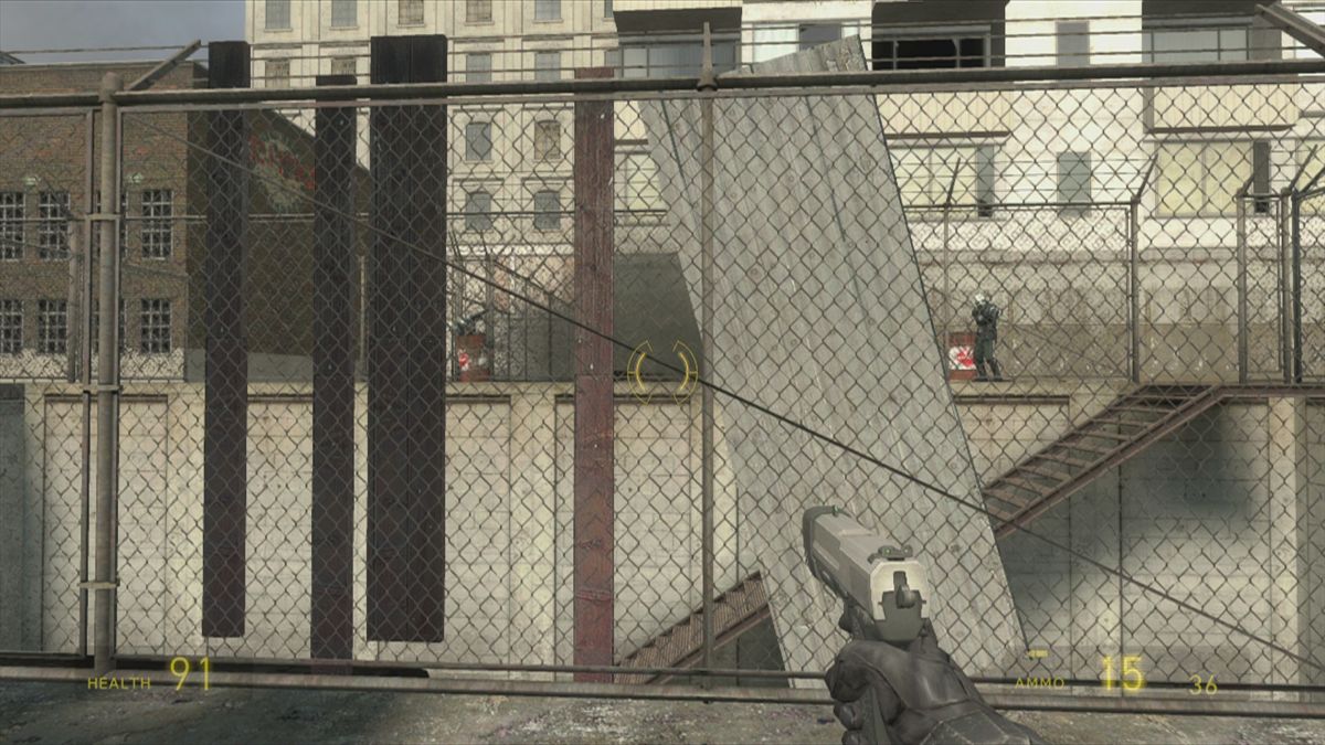 The Orange Box (Xbox 360) screenshot: <i>Half-Life 2</i>: detonating a barrel in the distance to disable enemies