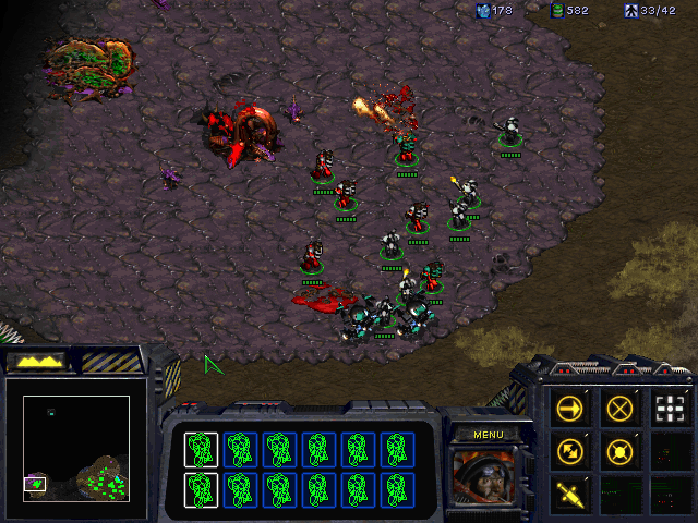 StarCraft (Demo Version) (Windows) screenshot: Attacking the Zerg base in a mission exclusive to the CD version. The objective here is to escort Cerberus operatives to the installation entrance.
