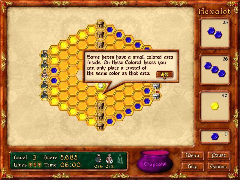 Hexalot (Windows) screenshot: By level threee the puzzles are using multiple colours and some cells will only accept a specific coloured crystal