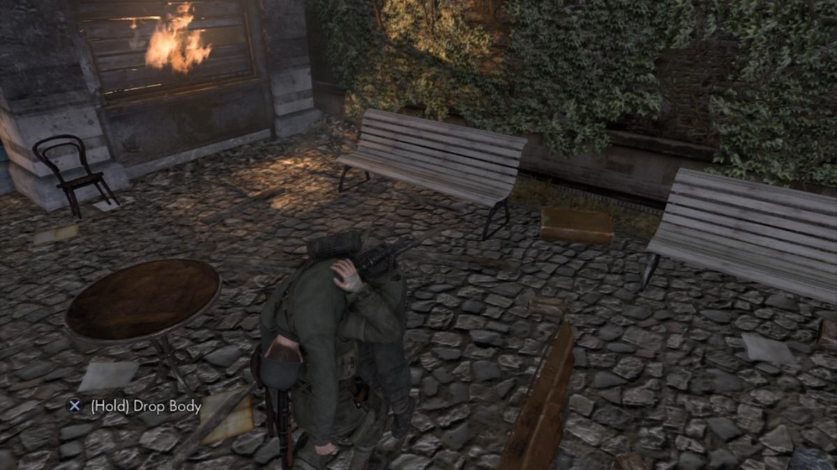 Sniper Elite V2 (PlayStation 3) screenshot: You can move enemy body so the patrols don't discover you too early, or you can even booby-trap it.