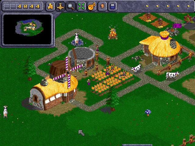 Beasts & Bumpkins (Windows) screenshot: Some peasants tend to the fields, while other build new cottage.