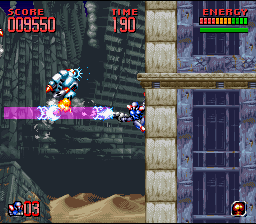 Super Turrican 2 (SNES) screenshot: Climbing a wall while fighting off enemies