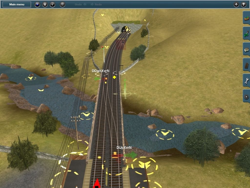 Trainz Simulator 2009: World Builder Edition (Windows) screenshot: This is a track view in the Surveyor tool. Each node of interest is indicated with rotating circles and symbols.