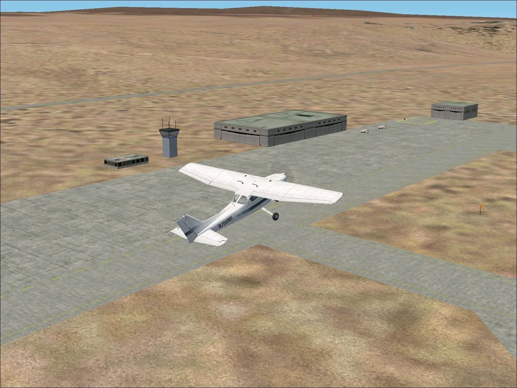 Scenery Spain 3: Canary Islands (Windows) screenshot: Fuerteventura by day, shortly after take-off, using the Flight Simulator 2002 default scenery Flight Simulator 2002