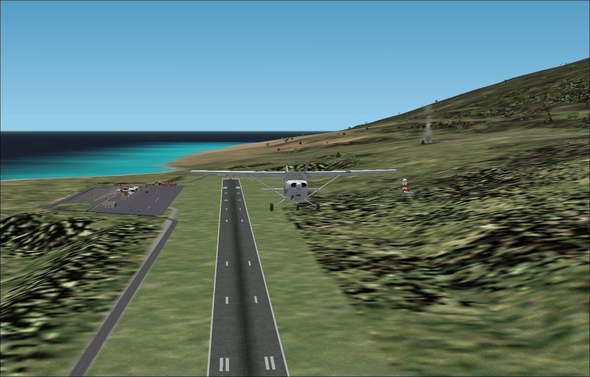 Scenery Spain 3: Canary Islands (Windows) screenshot: Las Palmas shortly after take-off showing the extent of the airport Flight Simulator 2002
