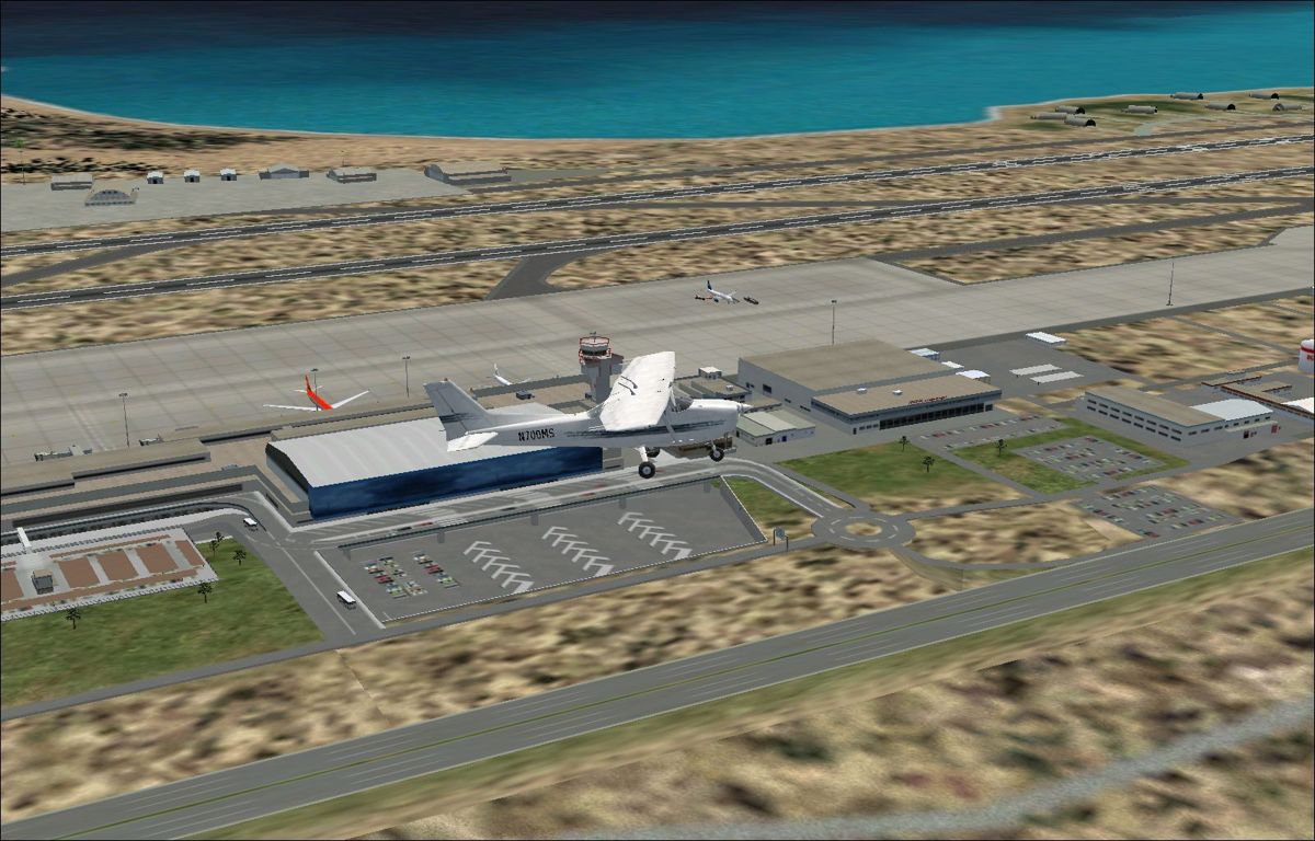 Scenery Spain 3: Canary Islands (Windows) screenshot: Gran Canaria showing some of the static aircraft Flight Simulator 2002