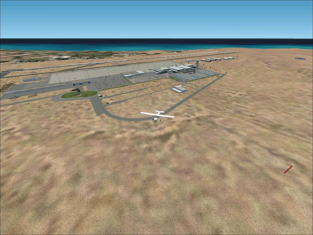 Scenery Spain 3: Canary Islands (Windows) screenshot: Lanzarote by day from altitude and distance showing the extent of the airport Flight Simulator 2002