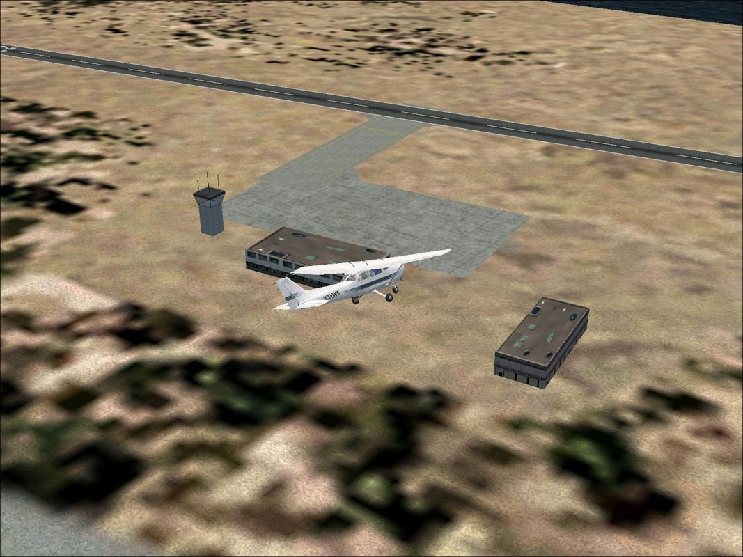 Scenery Spain 3: Canary Islands (Windows) screenshot: La Gomera shortly after take-off, using the Flight Simulator 2002 default scenery